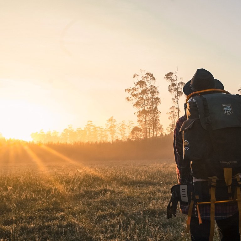 man-in-black-backpack-during-golden-hour-1230302.jpg